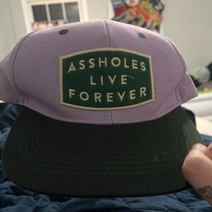Purple and Green Cap with Bold Statement
